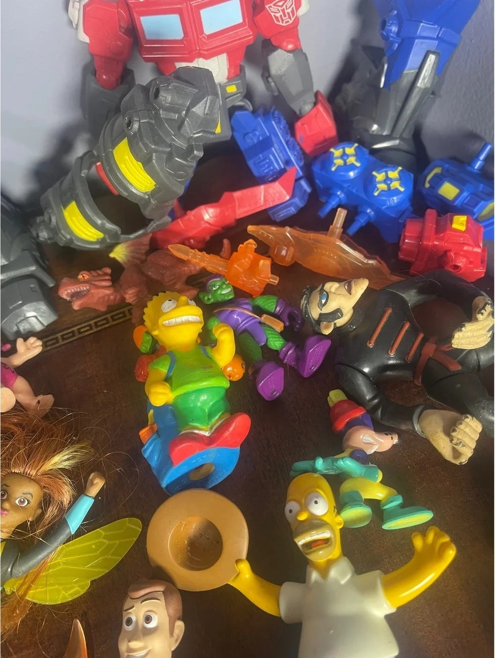 Mixed Lot of Vintage and Modern Action Figures Including Transformers, Simpsons,